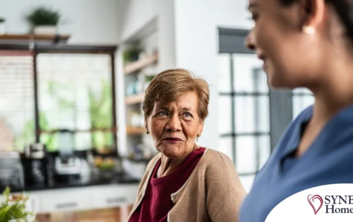 Caregiver provides attentive senior care as part of diabetes awareness